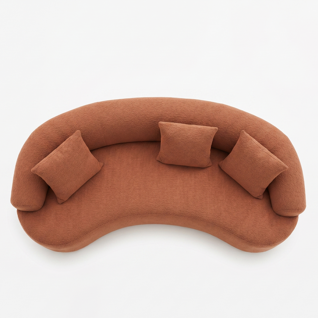 Brown curved sofa with three cushions on a white background