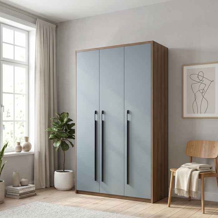 Modern wardrobe with wooden frame and glass doors in a room with a chair, plants, and artwork.