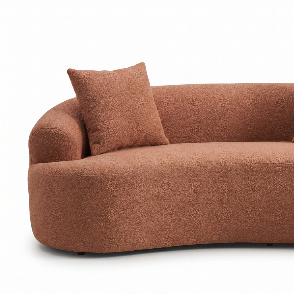 Brown sofa with three cushions on a white background